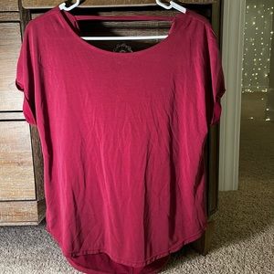 Francesca’s maroon open back shirt